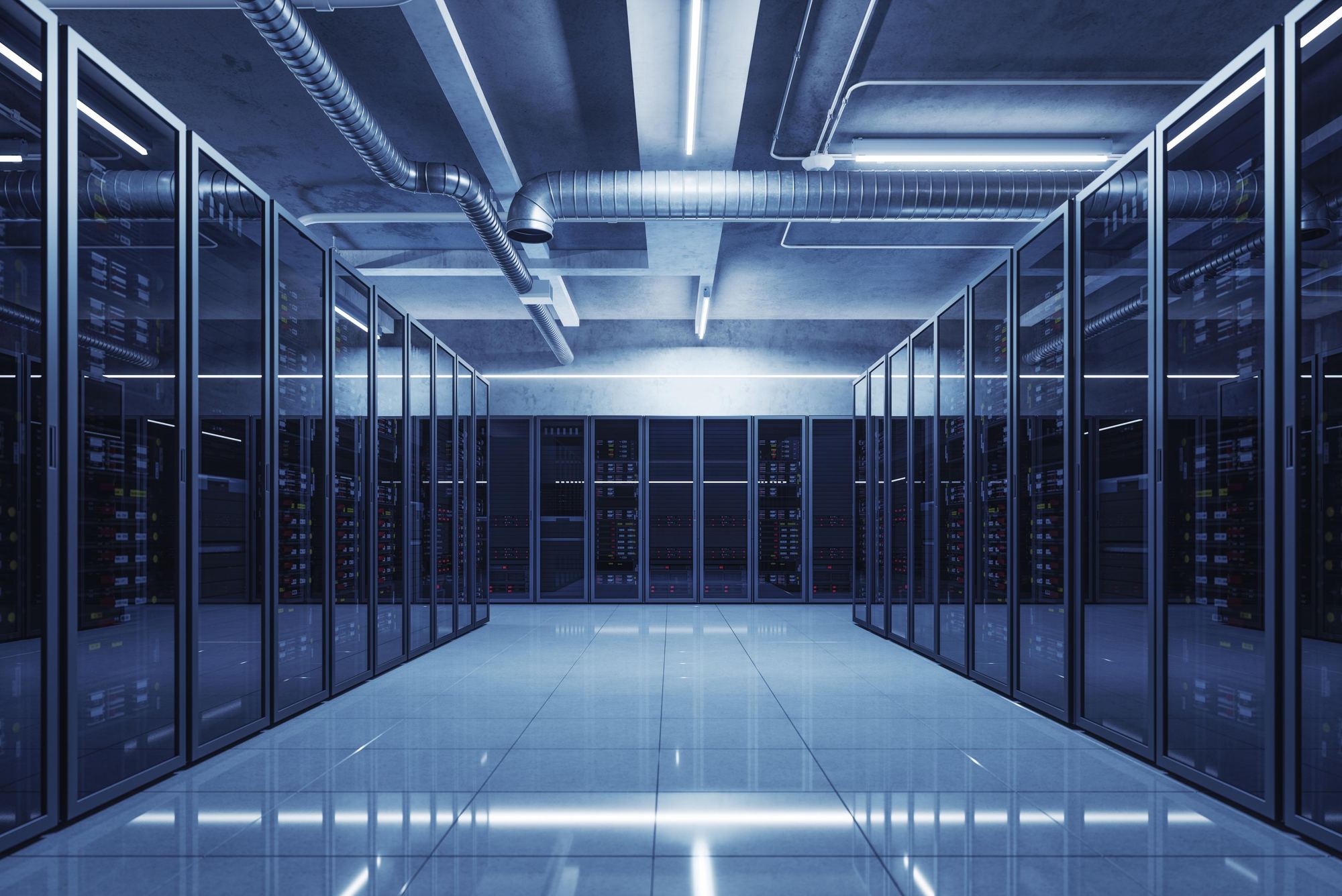 Data center server aisle with overhead ductwork and cable pathways