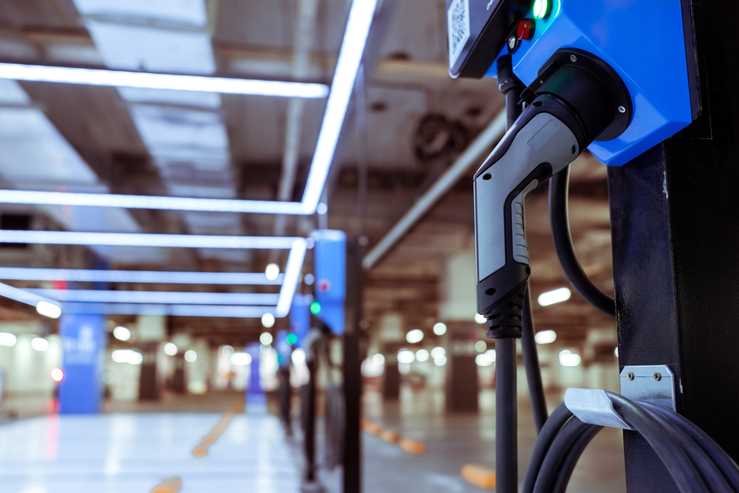Electric car charger in a modern parking garage